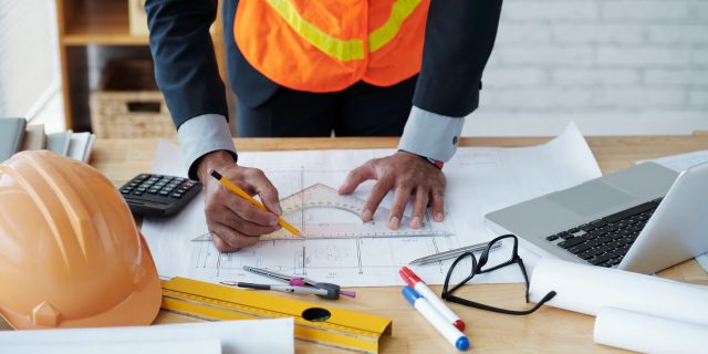 Cropped image of engineer drawing construction plan